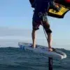 Rider hydrofoiling with the eFoilSolutions waist retractable leash kit in action, as seen during an eFoilgc session.